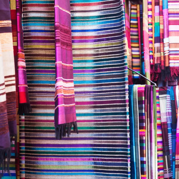 Colorful cloths in the souks of Marrakesh, Morocco — Stock Photo, Image