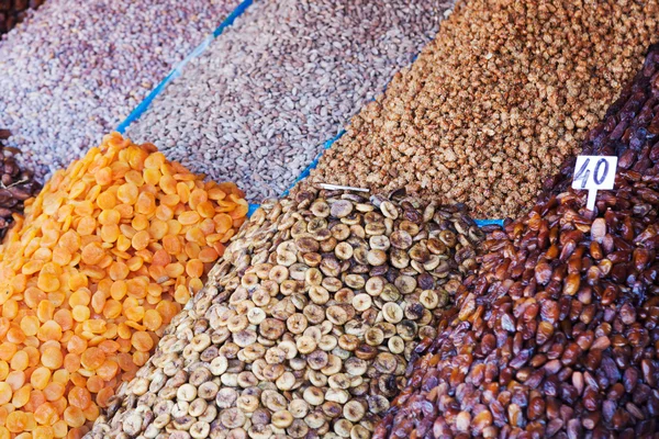 Dried fruits at a market stand of an oriental market in Marrakech — Stock Photo, Image