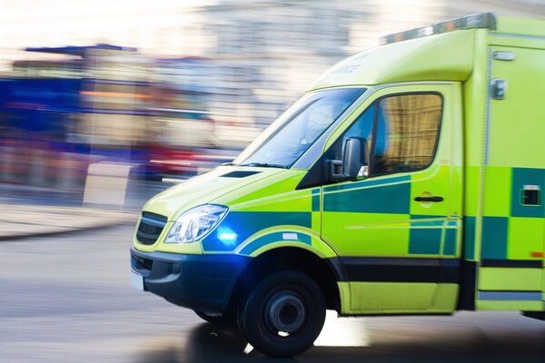 Urgent ambulance in London in motion blur