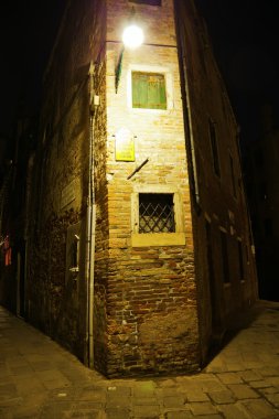 Dark alley in the old town of Venice, Italy, at night clipart
