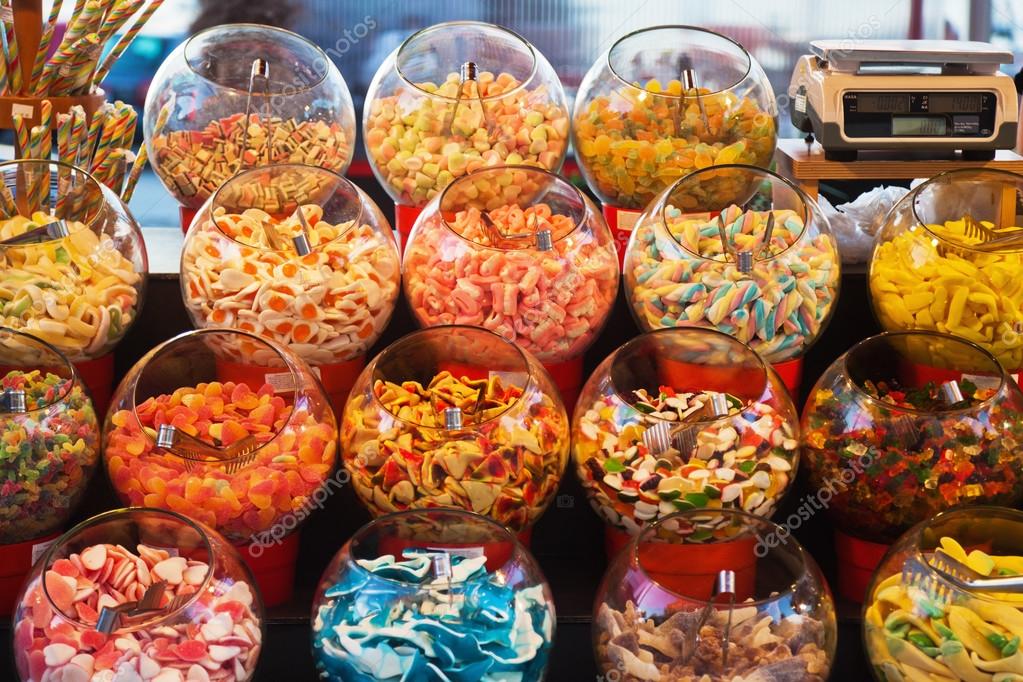 Market stall with candy bowls — Stock Photo © Madrabothair 56013697