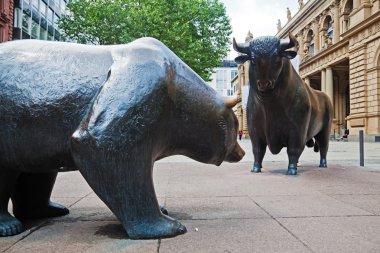Statues of the two symbolic beasts of finance, the bear and the bull, in front of the Frankfurt Stock Exchange clipart