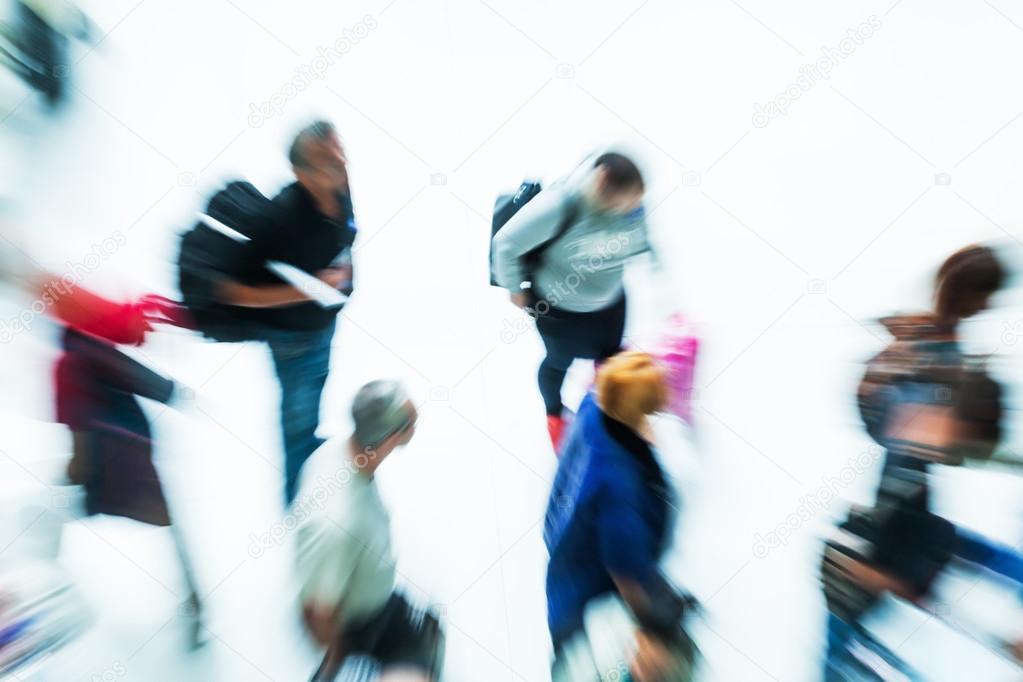 Top view of traveling people in motion blur