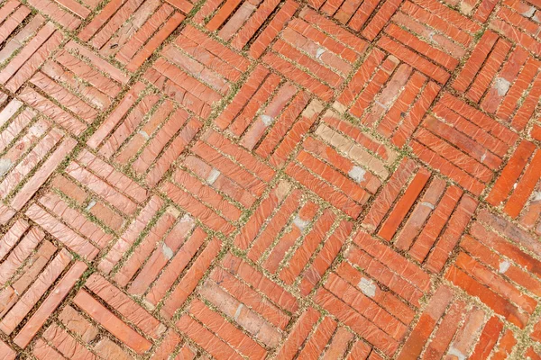 Hintergrundbild aus altem Ziegelsteinpflaster — Stockfoto