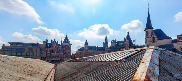 Old town of Antwerp, Belgium, over old roofs of parking lots — Stock Photo, Image