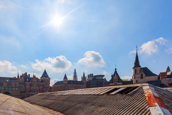 Old town of Antwerp, Belgium, over old roofs of parking lots — Stock Photo, Image