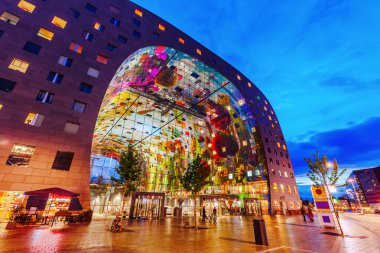 modern market hall in Rotterdam, Netherlands, at night clipart