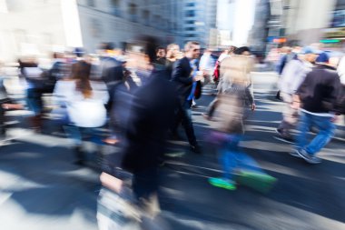 creative blur picture of commuters walking on the street