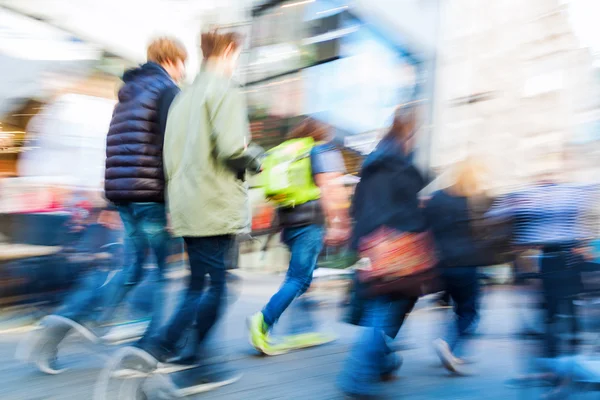 Crowd of people in motion blur walking in the city — Stock Photo, Image