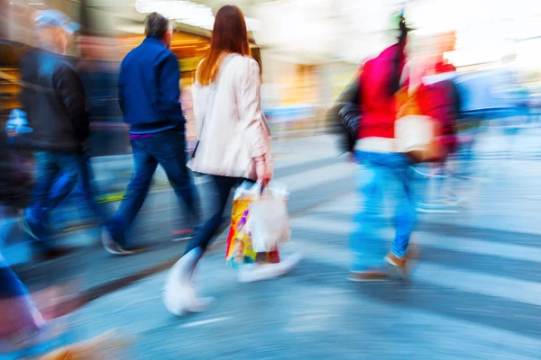 walking people in the city in motion blur