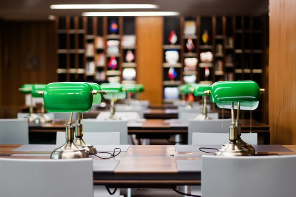 Editorail green lamp in library desk At C-Asean — Stock Photo, Image