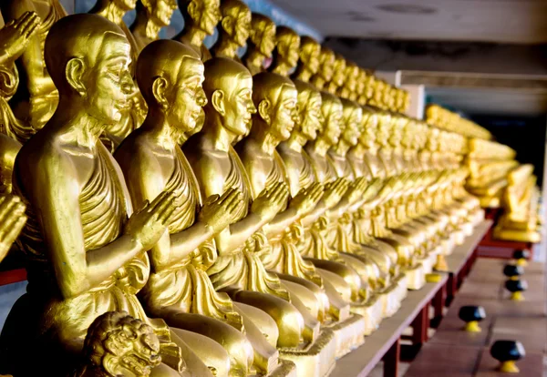 Many statue of gold monk — Stock Photo, Image