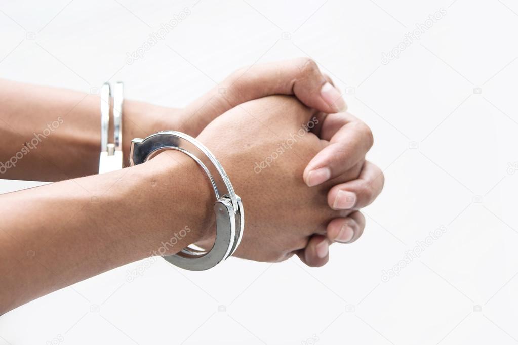 hand with shackle on white