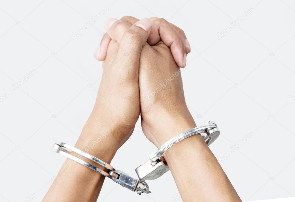 hand with shackle on white