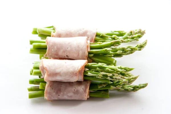 Bacon wrapping asparagus on isolate — Stock Photo, Image