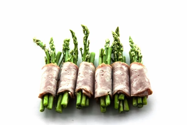 Bacon wrapping asparagus on isolate — Stock Photo, Image