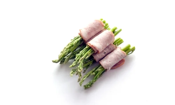 Bacon wrapping asparagus on isolate — Stock Photo, Image