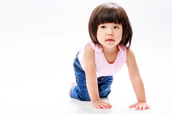 Asian girl crawl and looking in left — Stock Photo, Image