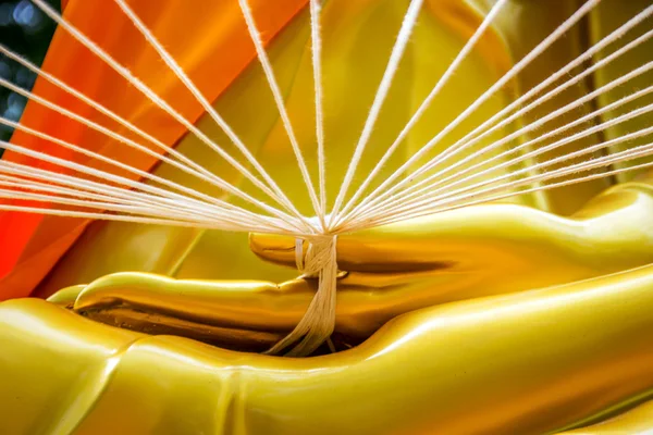 White rope in buddha statue hand — Stock Photo, Image