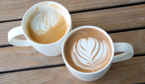 Latte art in coffee cup — Stock Photo, Image