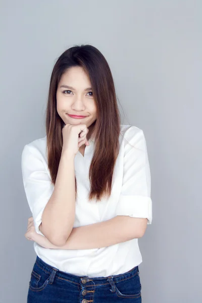 Asian lady action in with shirt and blue jeans — Stock Photo, Image