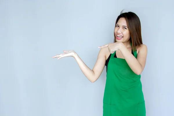 Asian girl action with green apron suite — Stock Photo, Image