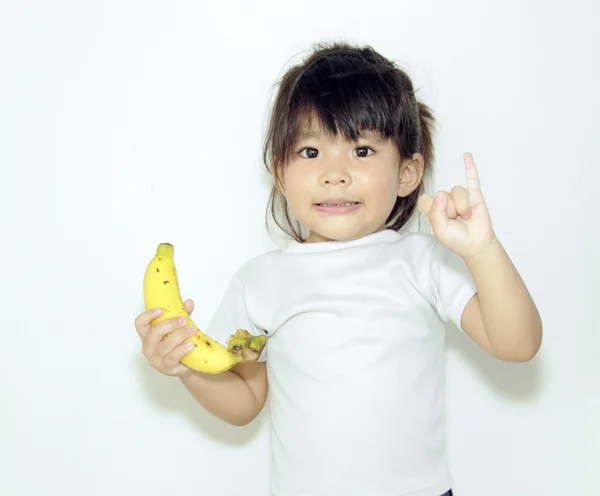 Menina asiática segurar banana — Fotografia de Stock