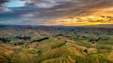 Farming countryside of the  Wairarapa hills and valleys flying  back to Masterton from the East Coast into a stunning sunset