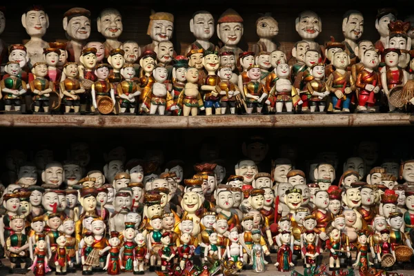 Window display of wooden puppets — Stock Photo, Image