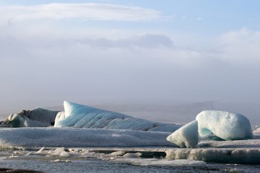 Buzul buz lagün sırasında günbatımı Jokullsarlon, İzlanda
