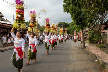 Village temple procession in Bali, Indonesia. clipart