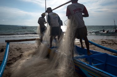 Fishermen at work in Jimbaran, Bali Island.