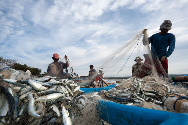 Fishermen at work in Jimbaran, Bali Island