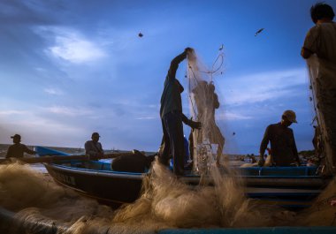 Fishermen at work in Jimbaran, Bali Island.