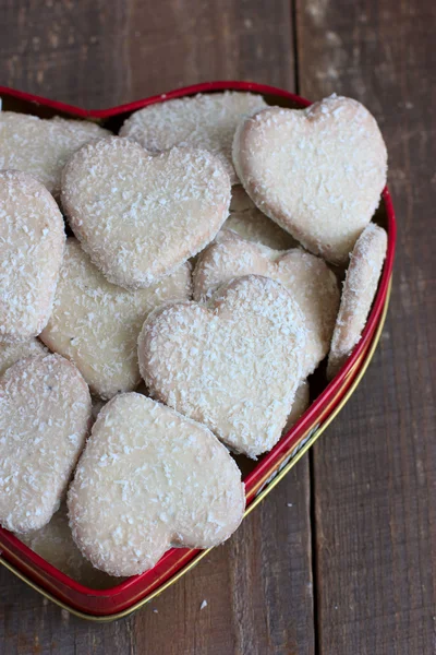 Heart shape cookies with coconut icing — Stock Photo, Image