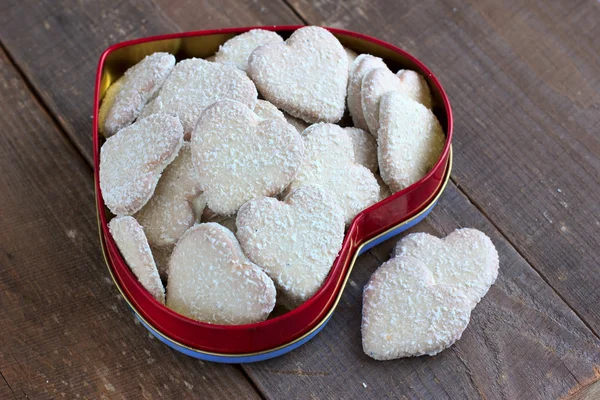 Heart shape cookies with coconut icing — Stock Photo, Image