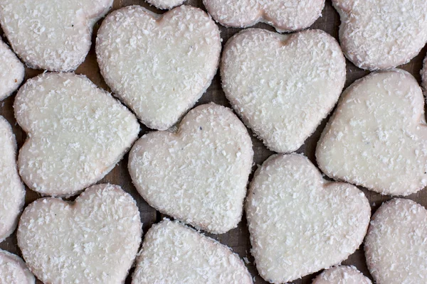 Heart shape cookies with coconut icing — Stock Photo, Image