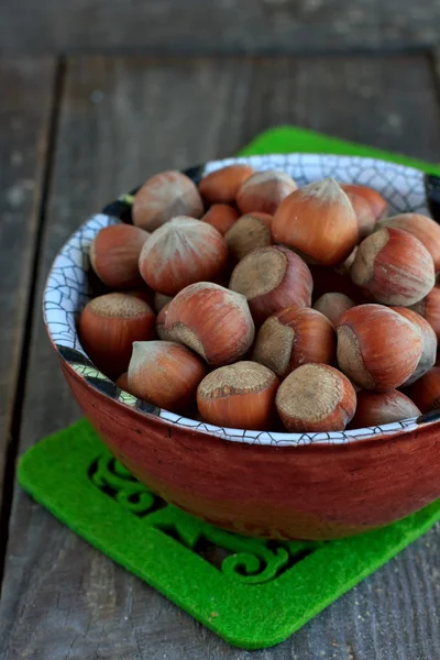 Hazelnuts in the ceramic bowl — Stock Photo, Image