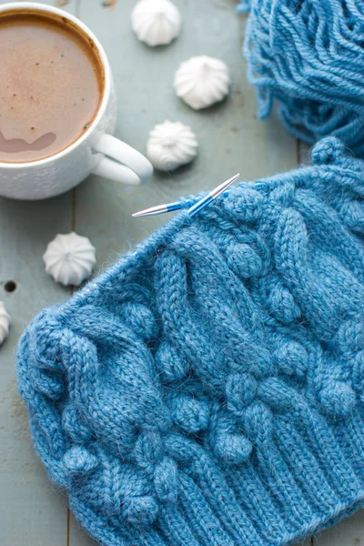 Knitting a turquoise pattern on the circular needles