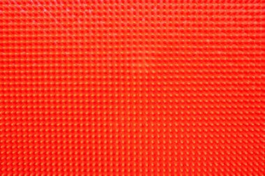 Kırmızı akupunktur ortopedi minderi. Çocuklar ve yetişkinlerde düz taban önleme için masaj paspası. Yukarıdan bak. Ortopedist. Önleme.