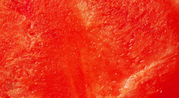 Close-up semangka merah. latar belakang. Pulp dari semangka matang. tekstur semangka. Sepotong semangka matang berair. Sepotong buah berry.. — Stok Foto