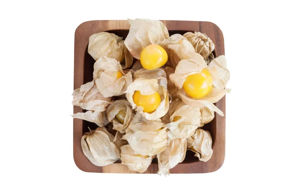 Uva spina del Capo (Physalis) in ciotole di legno isolate su bianco — Foto Stock