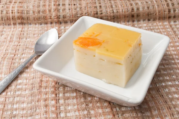 Coconut custard made from eggs and coconut milk,  in white bowl on Fabric — Stock Photo, Image