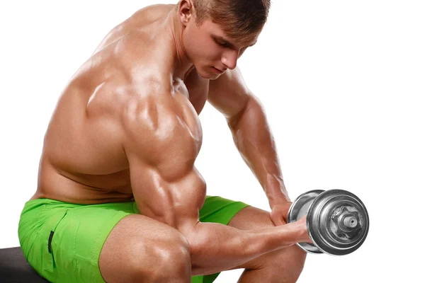 Muscular man working out doing exercises with dumbbells at biceps, strong male naked torso, isolated over white background — Stock Photo, Image