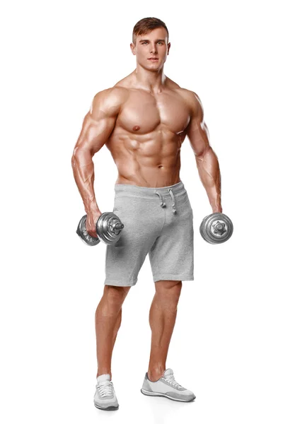 Sexig atletisk man visar muskulös kropp med hantlar, full längd, isolerade över vit bakgrund. Starka manliga nakna överkropp abs — Stockfoto