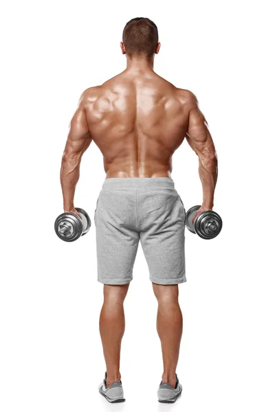 Homme athlétique sexy montrant le corps musculaire avec haltères, vue arrière, pleine longueur, isolé sur fond blanc. Torse nu masculin fort — Photo