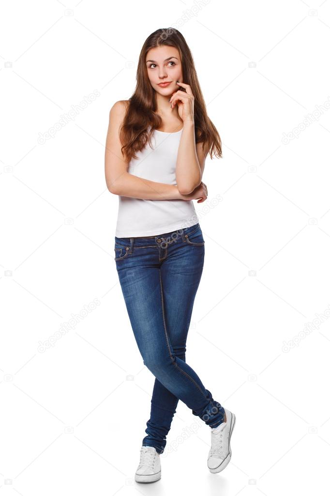 Young beautiful woman thinking looking to the side at blank copy space ...