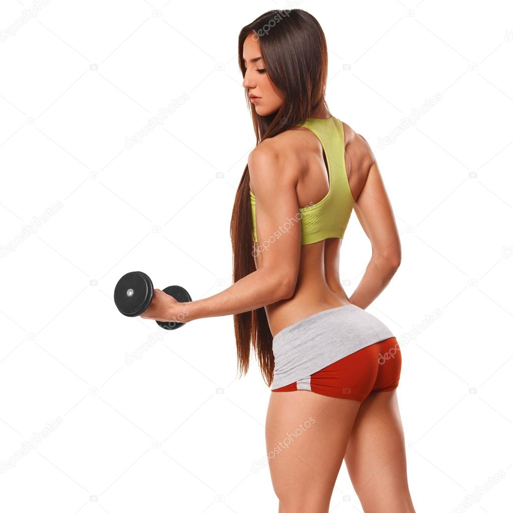 Sexy athletic woman with dumbbells