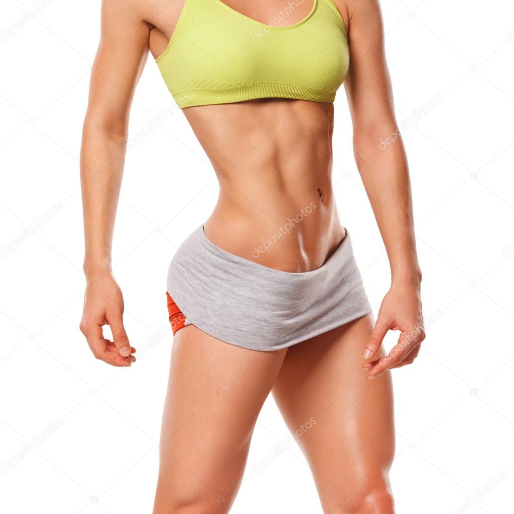Fitness woman showing abs and flat belly