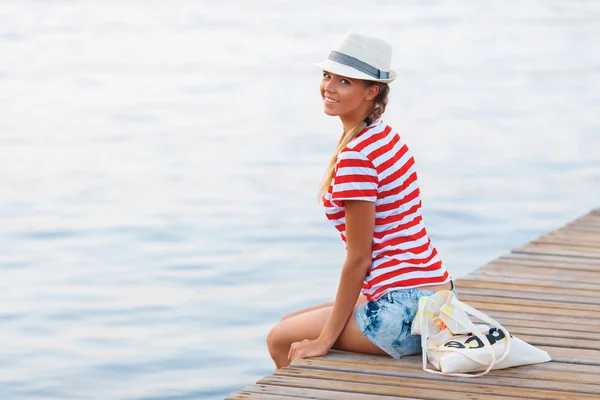 Beautiful happy woman on pier — Stock Photo, Image